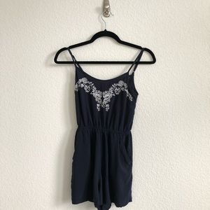 Divided romper with criss cross detail